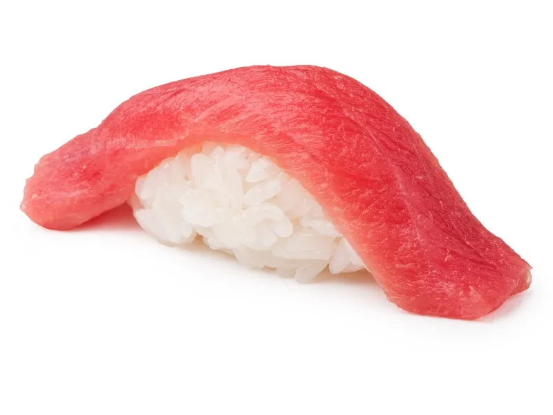 Tuna nigiri sushi with fresh raw tuna on sushi rice at Yummy Sushi & Bento, a Japanese Restaurant in Flushing